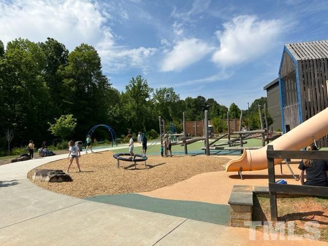 301 Devon Cliffs Drive Wake Forest, NC 27587 - Photo 25 of 26 a view of a park with swings and slides