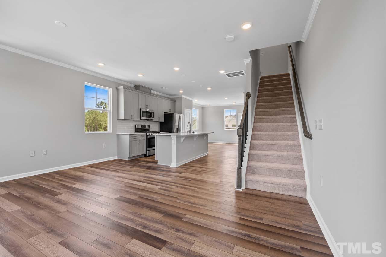301 Devon Cliffs Drive Wake Forest, NC 27587 - Photo 6 of 26 a view of kitchen and wooden floor