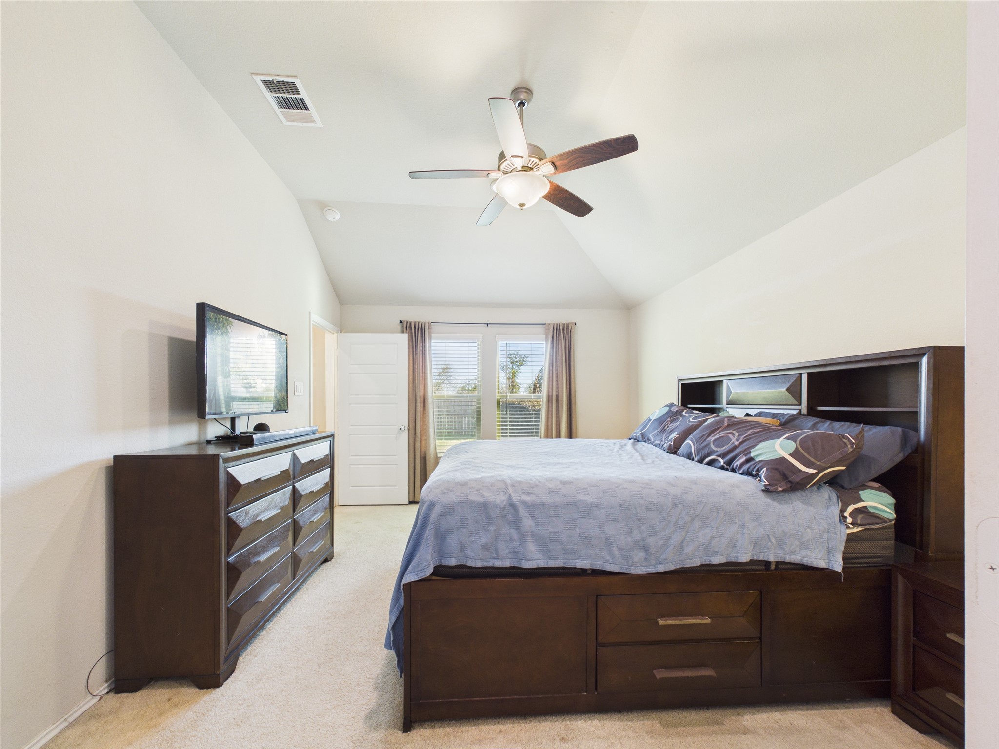 1237 Steed Bluff Drive Alvin, TX 77511 - Photo 21 of 50 a bedroom with a bed and dresser