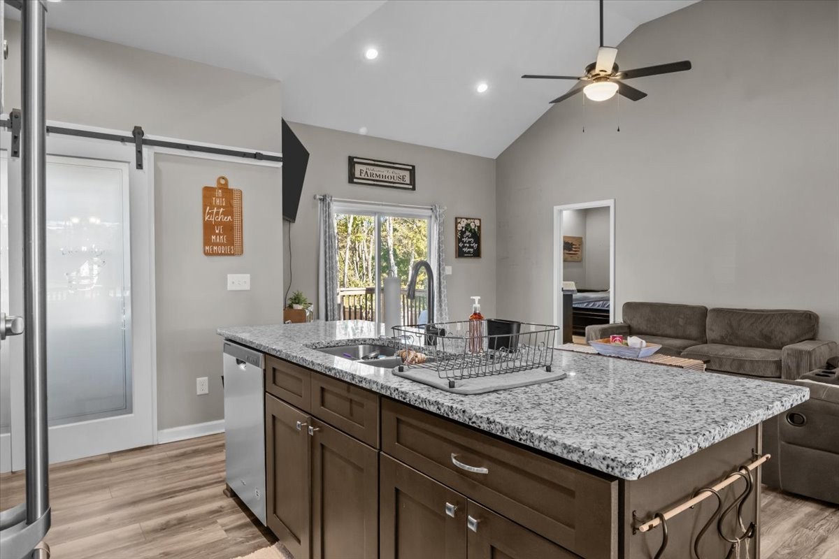 120 Pinethicket Road McEwen, TN 37101 - Photo 12 of 36 a bathroom with a granite countertop sink a mirror and shower