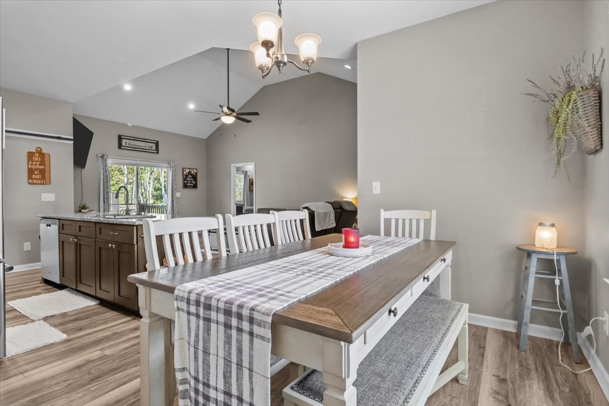 120 Pinethicket Road McEwen, TN 37101 - Photo 14 of 36 a view of a dining room with furniture a chandelier and wooden floor