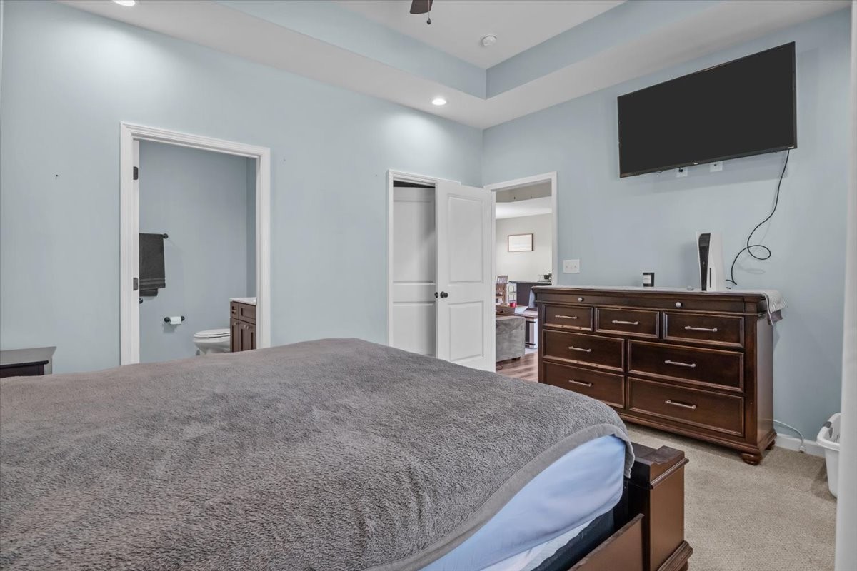 120 Pinethicket Road McEwen, TN 37101 - Photo 17 of 36 a bedroom with a bed and flat screen tv