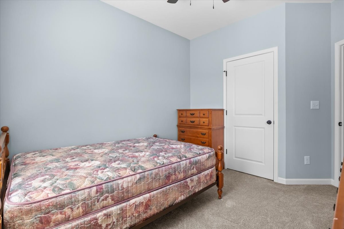 120 Pinethicket Road McEwen, TN 37101 - Photo 25 of 36 a bedroom with a bed and small cabinets