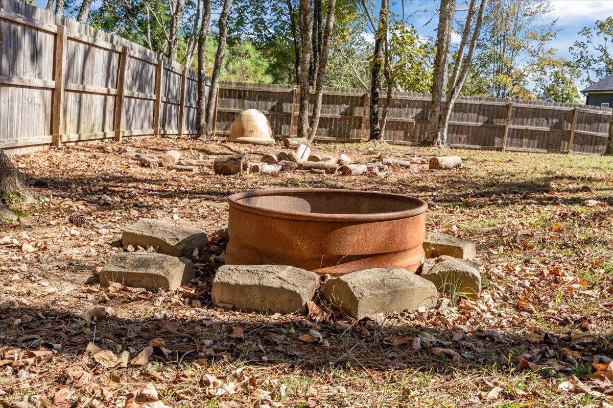 120 Pinethicket Road McEwen, TN 37101 - Photo 30 of 36 a backyard of a house with barbeque oven