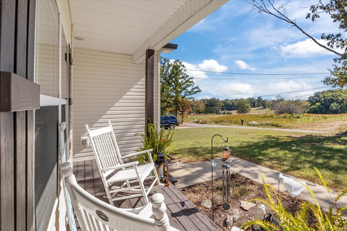 120 Pinethicket Road McEwen, TN 37101 - Photo 3 of 36 a view of a balcony with lake view and a floor to ceiling window