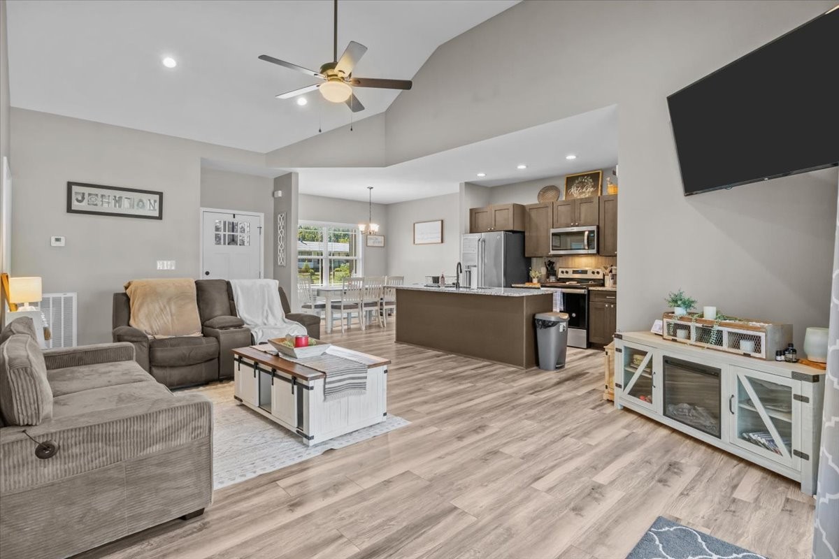 120 Pinethicket Road McEwen, TN 37101 - Photo 5 of 36 a living room with furniture flat screen tv and kitchen view