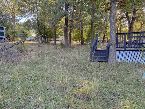 a view of outdoor space with deck and tree