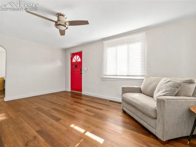 a living room with furniture and a window