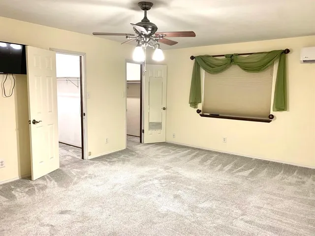 a view of a front door and wooden floor
