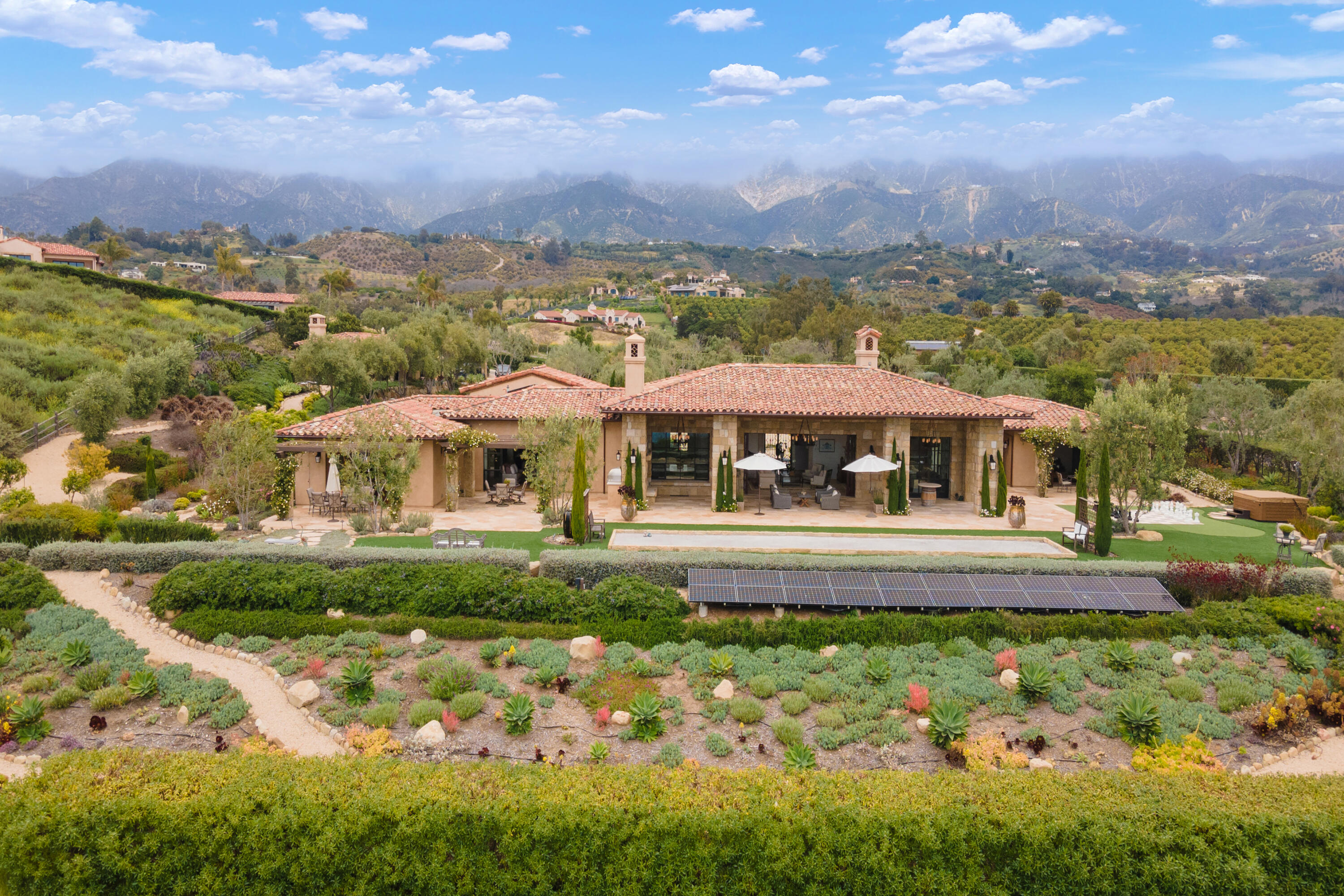 130 Montecito Ranch Lane Summerland, CA 93067 - Photo 4 of 33 a front view of a house with a garden