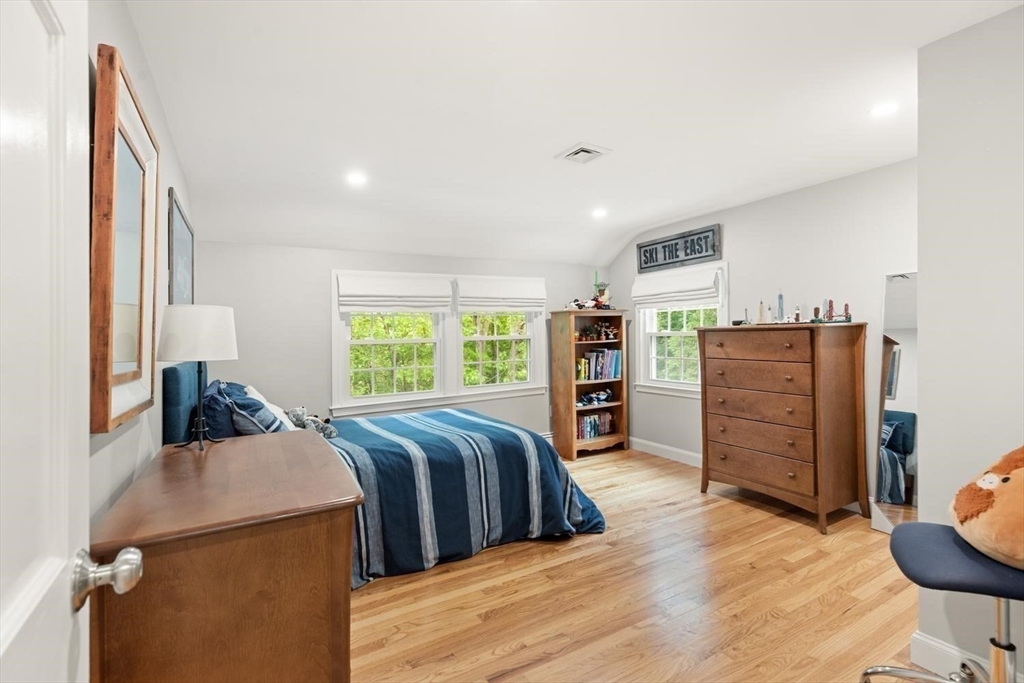 105 Thornberry Road Winchester, MA 01890 - Photo 22 of 35 a bed room with a bed and dresser