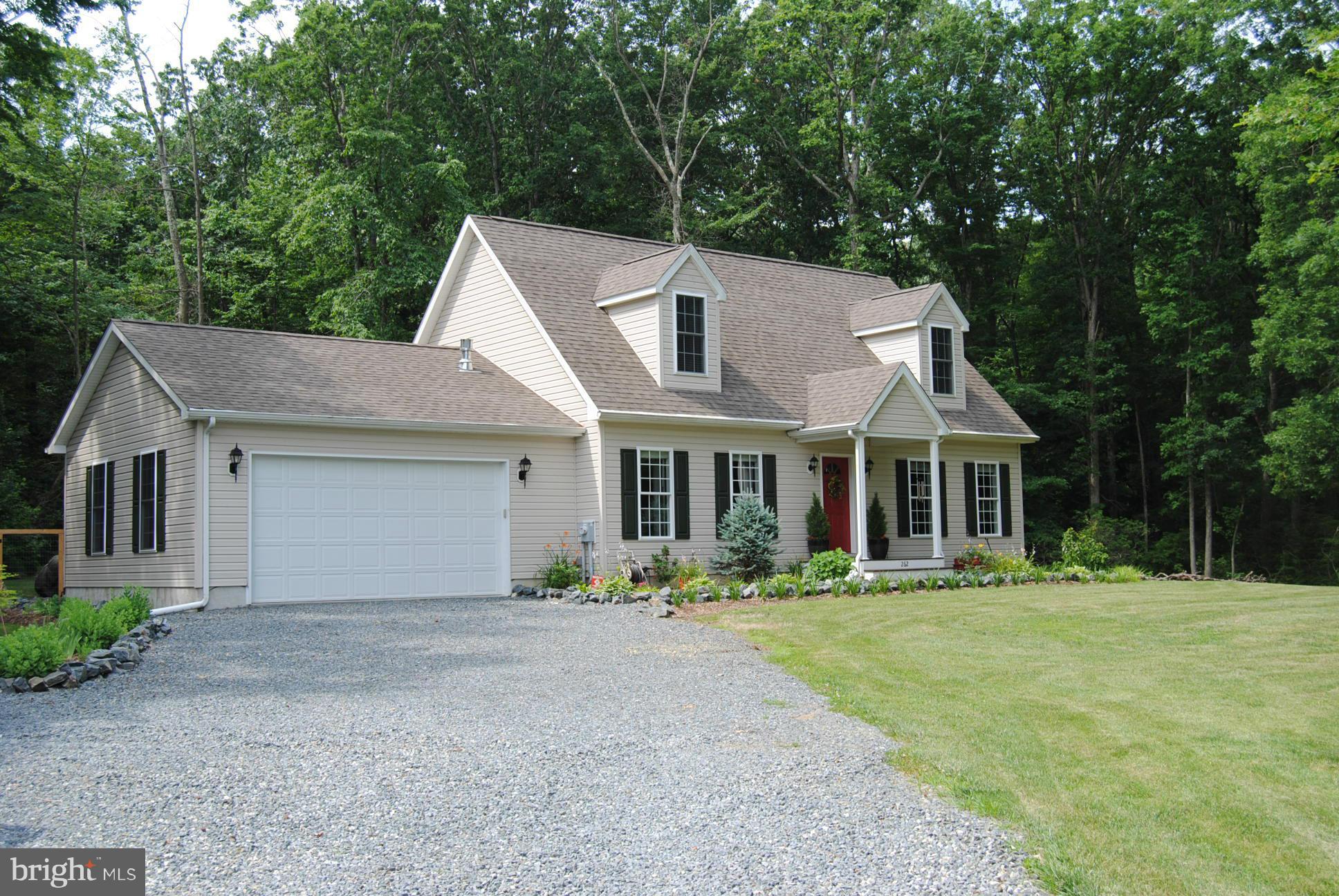 262 Nottingham Road Elkton, MD 21921 - Photo 1 of 23 a front view of a house with a garden and trees
