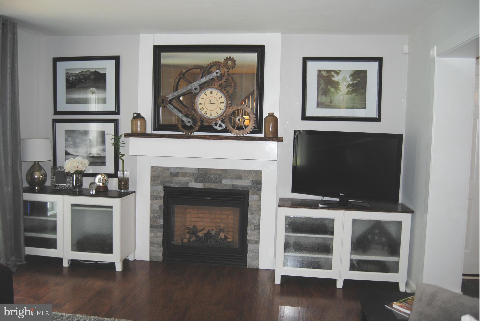 262 Nottingham Road Elkton, MD 21921 - Photo 3 of 23 a living room with a fireplace and a flat screen tv