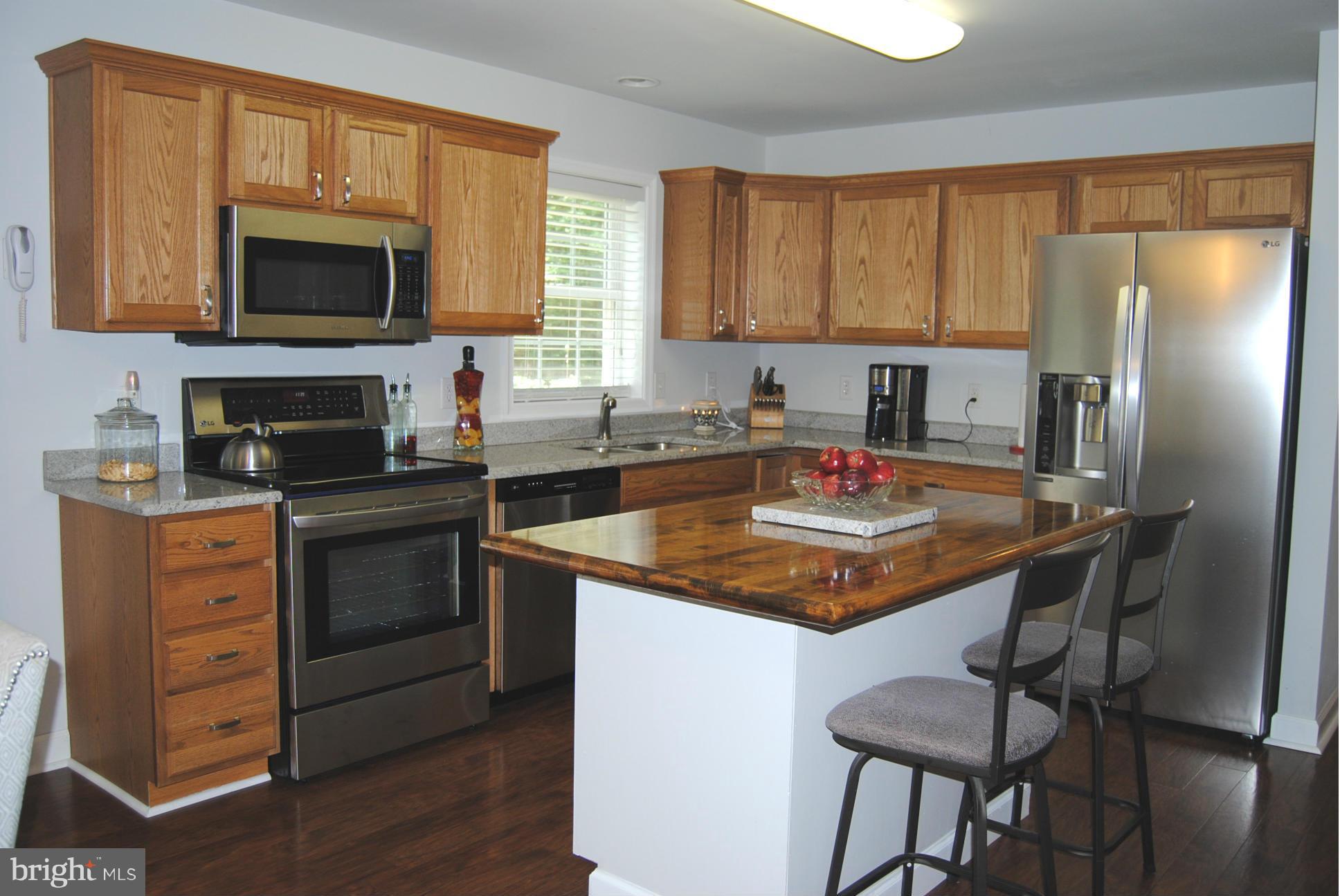 262 Nottingham Road Elkton, MD 21921 - Photo 5 of 23 a kitchen with granite countertop a sink stove and refrigerator
