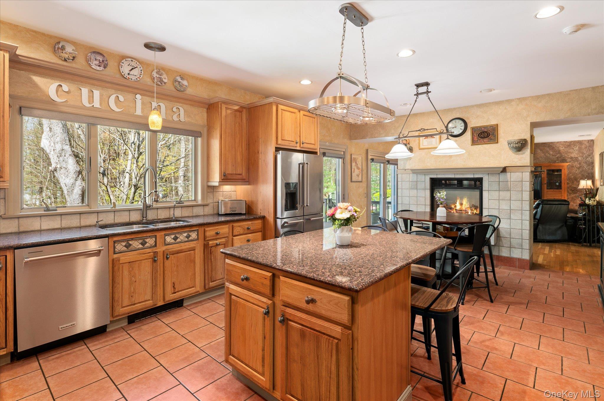 85 Orchard Hill Road Carmel, NY 10512 - Photo 11 of 50 a kitchen with stainless steel appliances granite countertop counter space a sink cabinets and wooden floor
