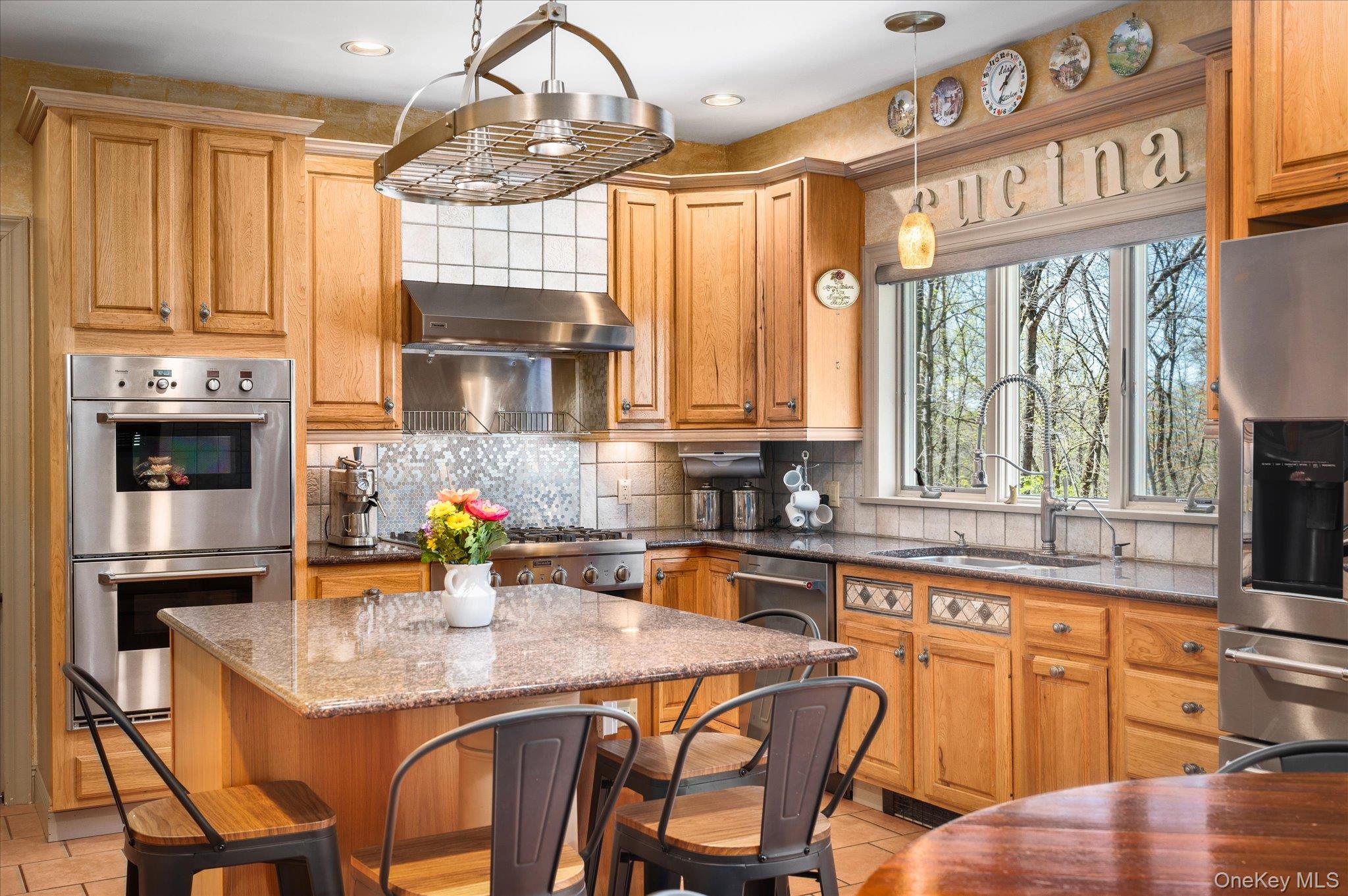 85 Orchard Hill Road Carmel, NY 10512 - Photo 12 of 50 a kitchen with stainless steel appliances granite countertop a stove a sink dishwasher and a microwave oven with cabinets
