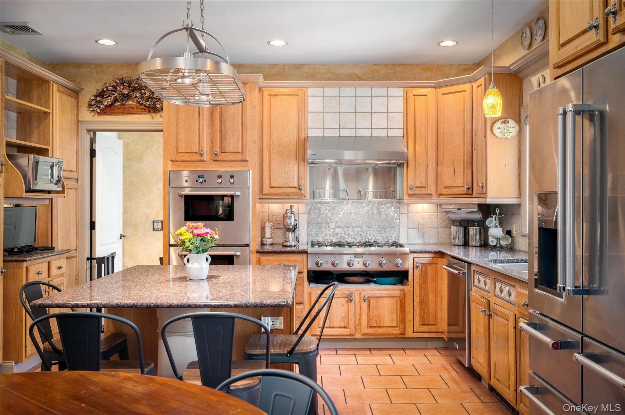 85 Orchard Hill Road Carmel, NY 10512 - Photo 13 of 50 a open kitchen with stainless steel appliances granite countertop a sink and cabinets