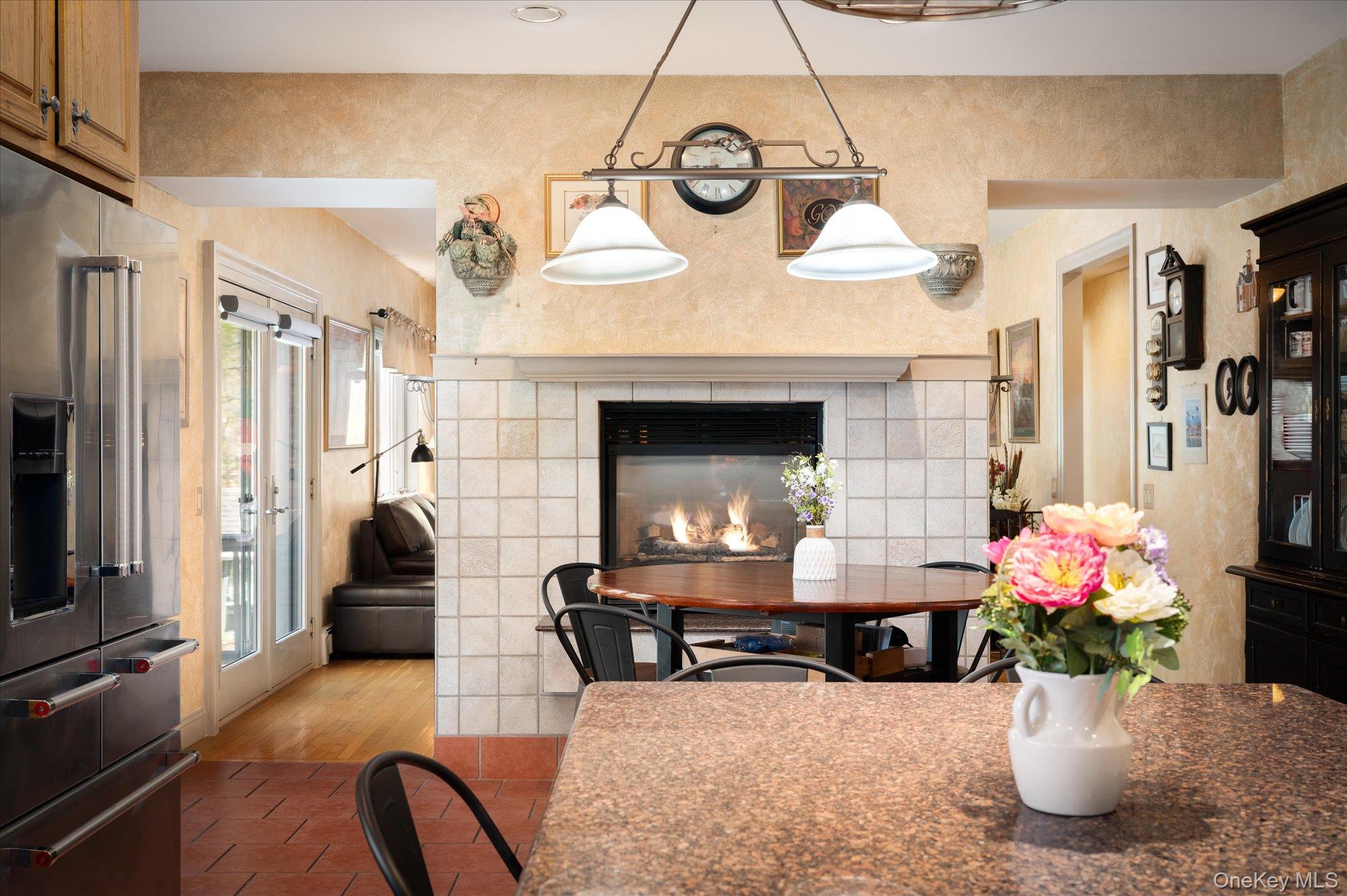 85 Orchard Hill Road Carmel, NY 10512 - Photo 15 of 50 a dining room with furniture and a fireplace