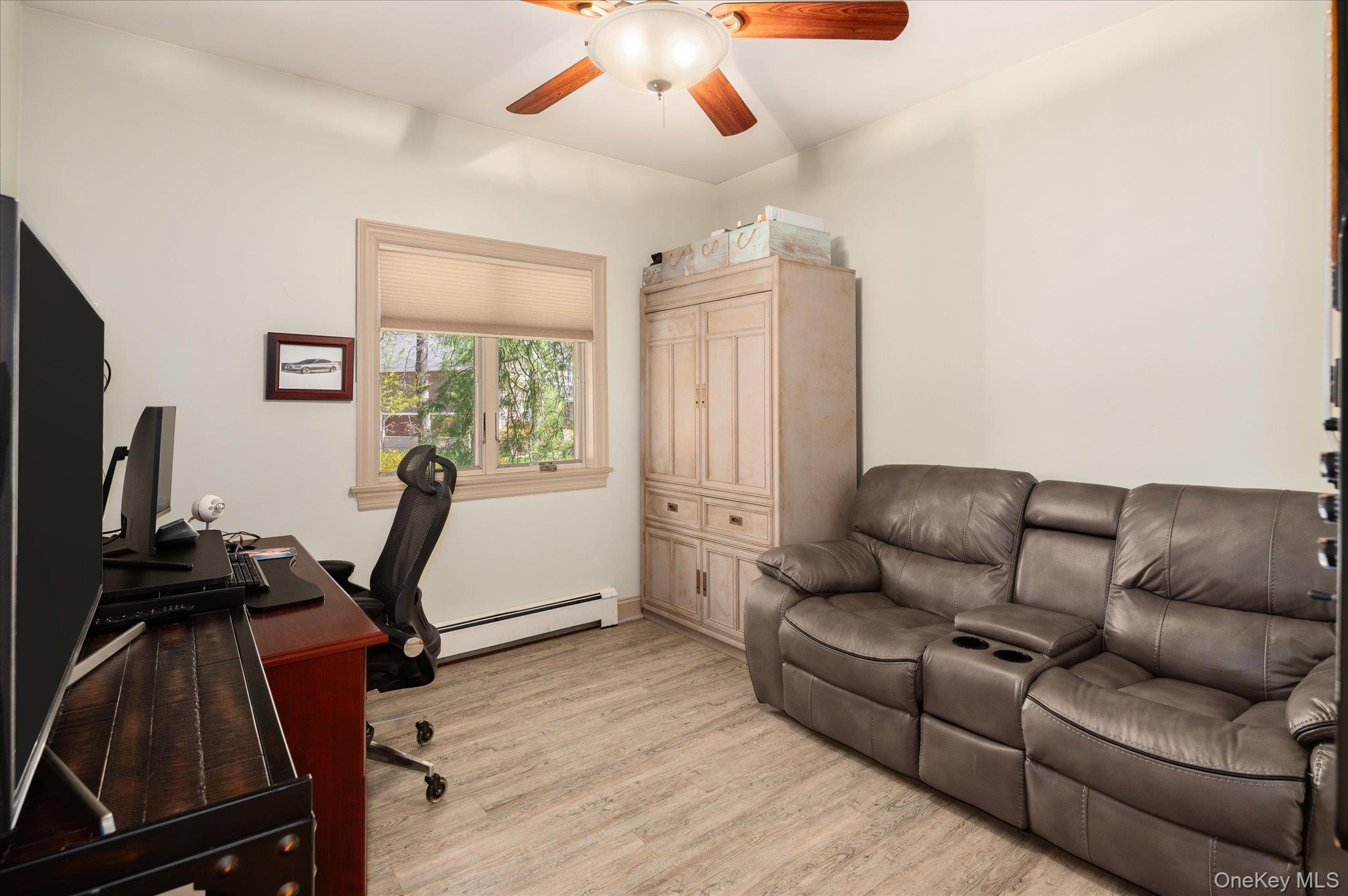 85 Orchard Hill Road Carmel, NY 10512 - Photo 19 of 50 a living room with furniture and a flat screen tv