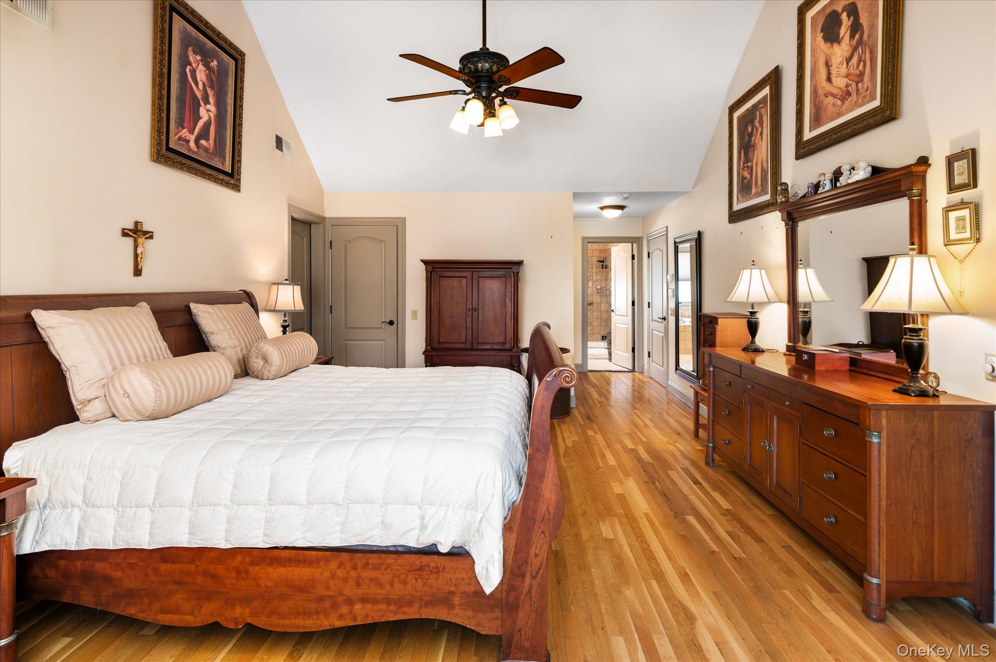 85 Orchard Hill Road Carmel, NY 10512 - Photo 25 of 50 a bed room with a bed and a chandelier