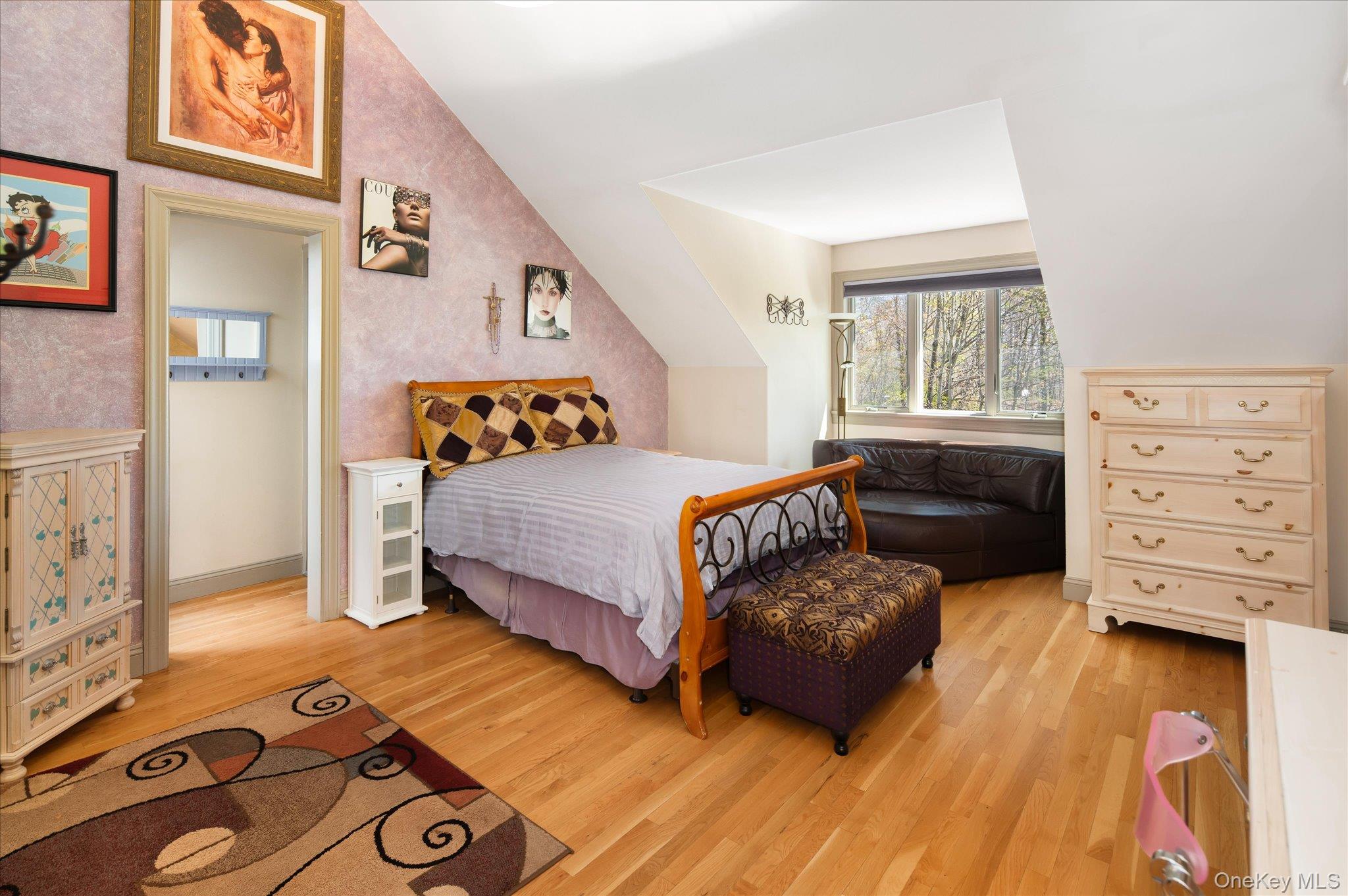 85 Orchard Hill Road Carmel, NY 10512 - Photo 27 of 50 a bedroom with a bed and wooden floor