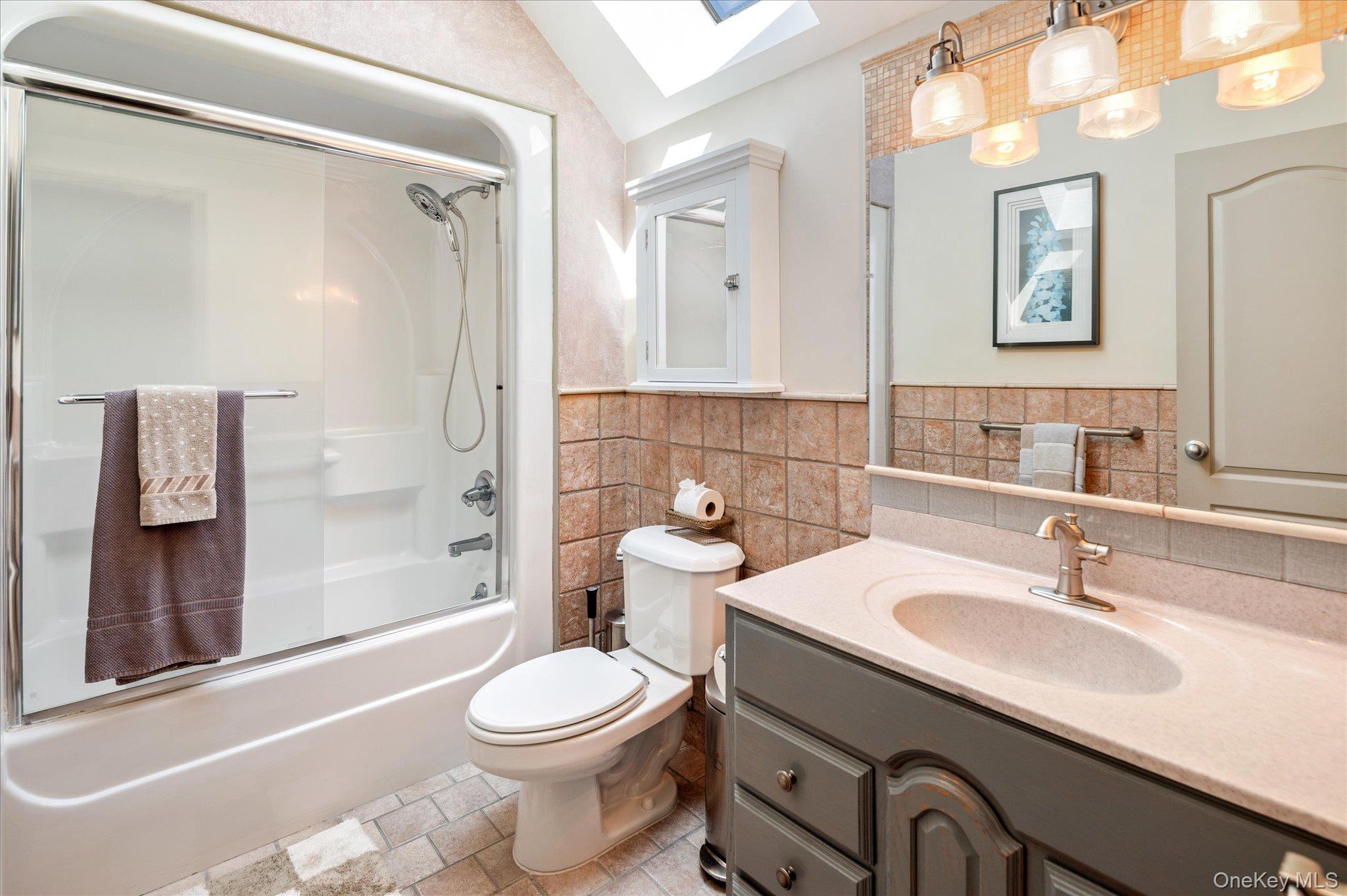 85 Orchard Hill Road Carmel, NY 10512 - Photo 28 of 50 a bathroom with a sink a toilet and shower