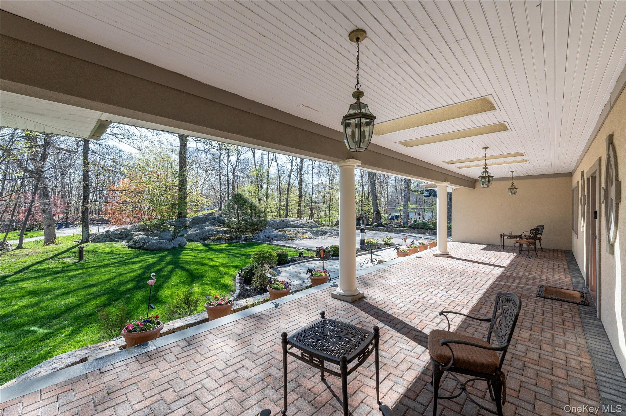 85 Orchard Hill Road Carmel, NY 10512 - Photo 3 of 50 a outdoor space with a large window and chandelier