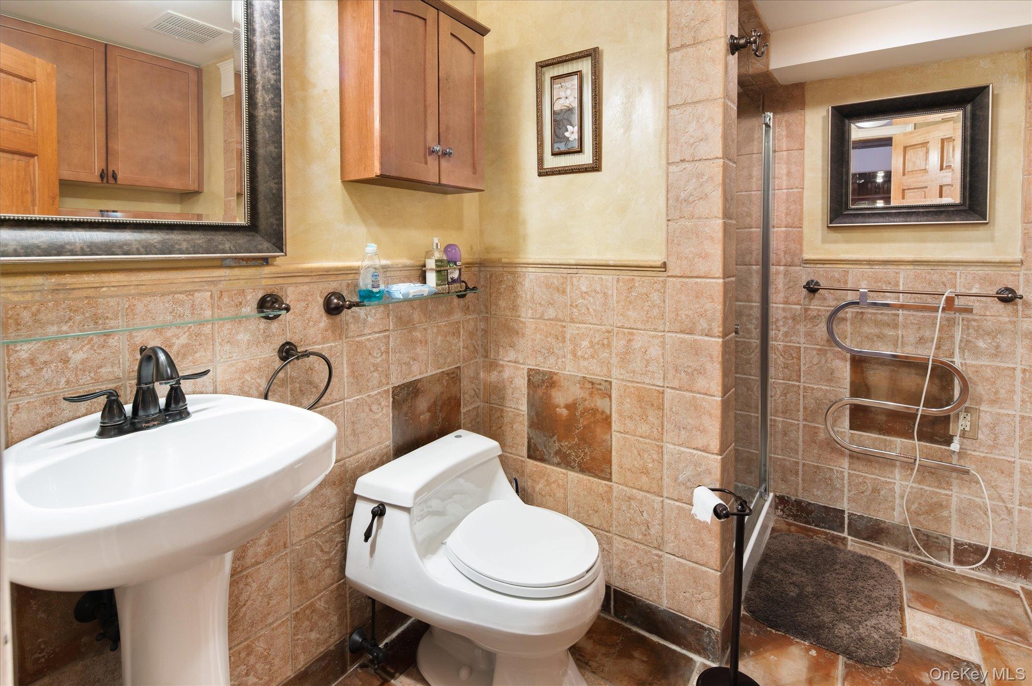 85 Orchard Hill Road Carmel, NY 10512 - Photo 38 of 50 a bathroom with a sink a toilet and mirror