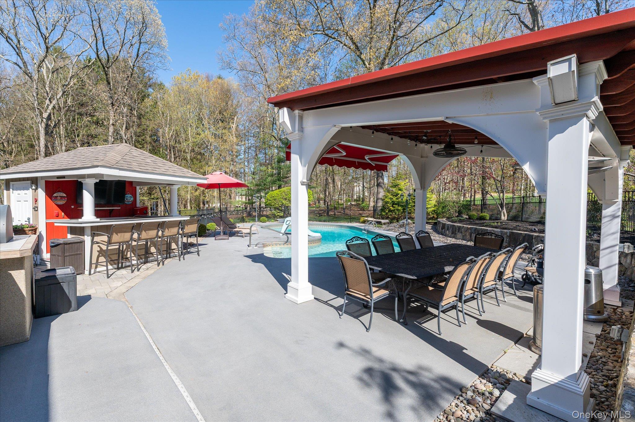 85 Orchard Hill Road Carmel, NY 10512 - Photo 41 of 50 a view of patio with a table and chairs under an umbrella