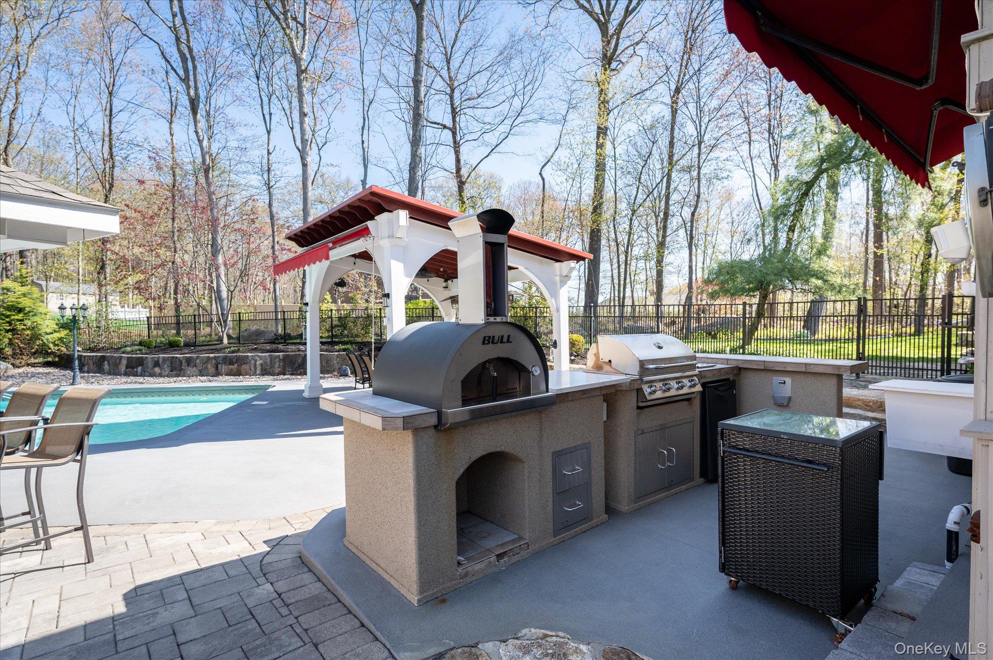 85 Orchard Hill Road Carmel, NY 10512 - Photo 44 of 50 a view of a patio with a yard fire pit and outdoor seating