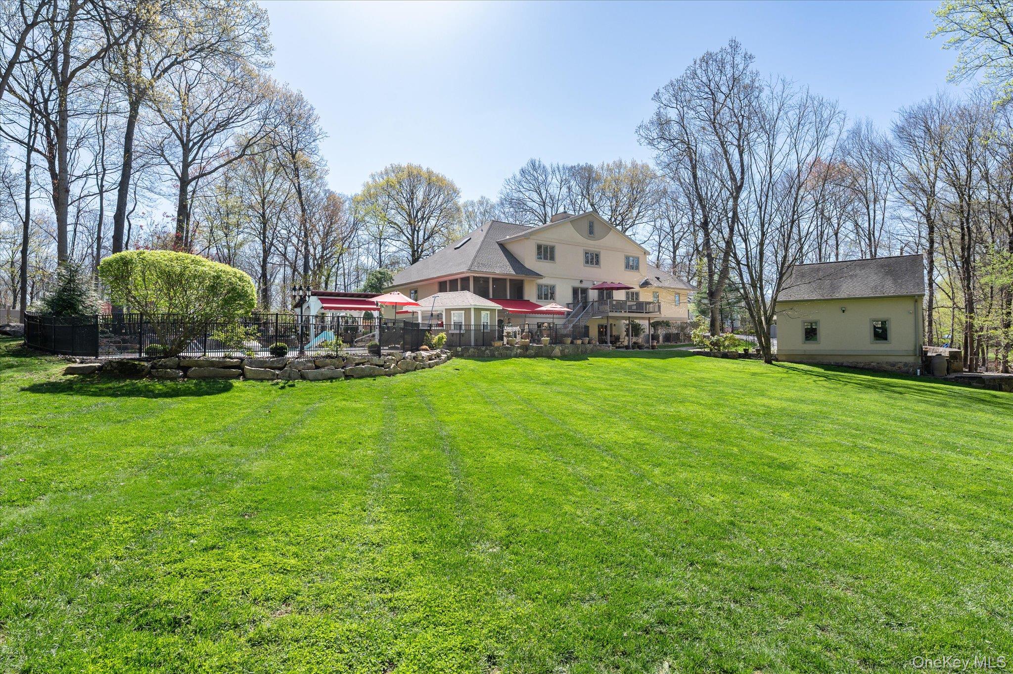 85 Orchard Hill Road Carmel, NY 10512 - Photo 49 of 50 a view of a house with a big yard and large trees