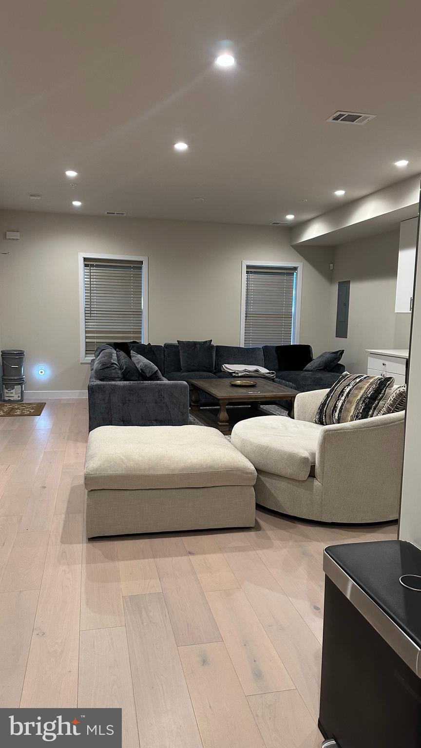 235 Valley Avenue Southeast Washington, DC 20032 - Photo 20 of 20 a living room with furniture and kitchen view
