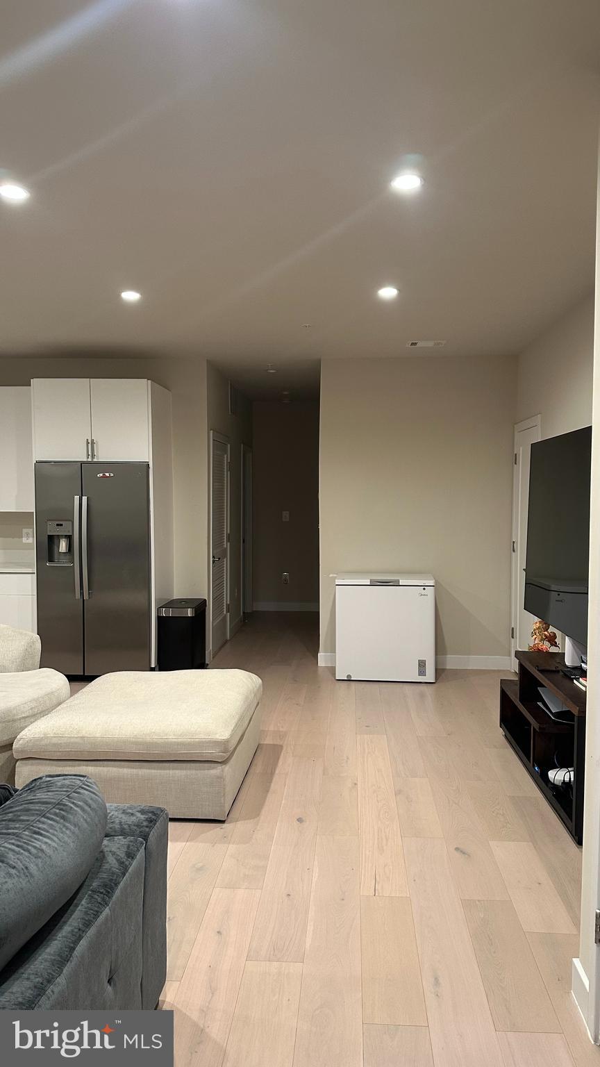 235 Valley Avenue Southeast Washington, DC 20032 - Photo 6 of 20 a living room with stainless steel appliances furniture and a flat screen tv