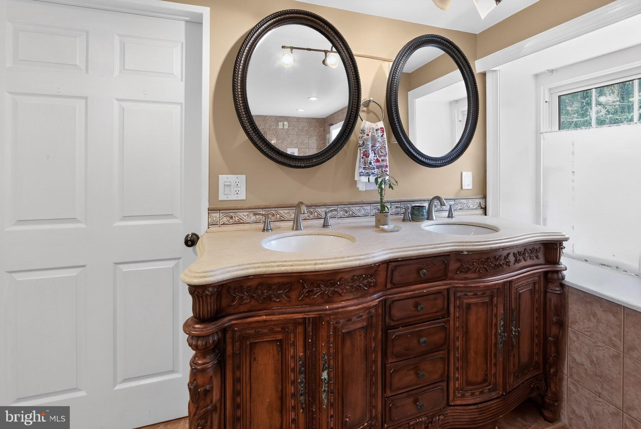 238 Brown Street Spring City, PA 19475 - Photo 22 of 57 Elegant dual-sink vanity with mirrors.