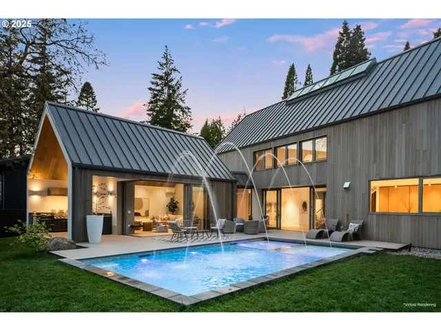 a view of an house with backyard and sitting area