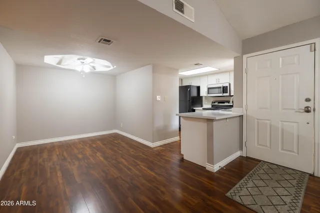 a view of kitchen and wooden floor