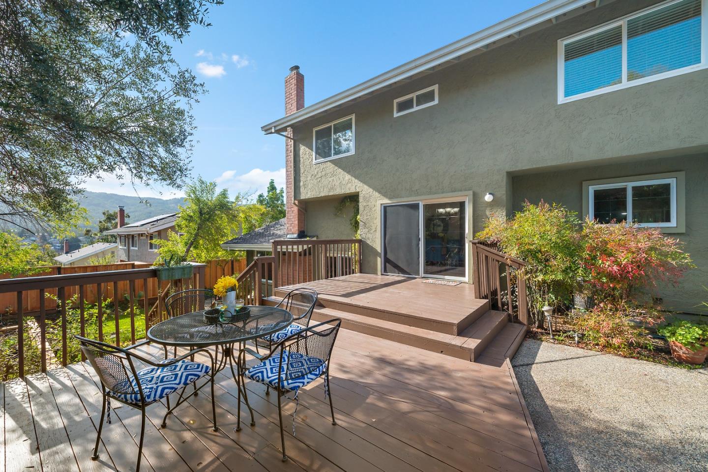 7054 Morecambe Drive San Jose, CA 95120 - Photo 14 of 50 a view of a patio with table and chairs and potted plants