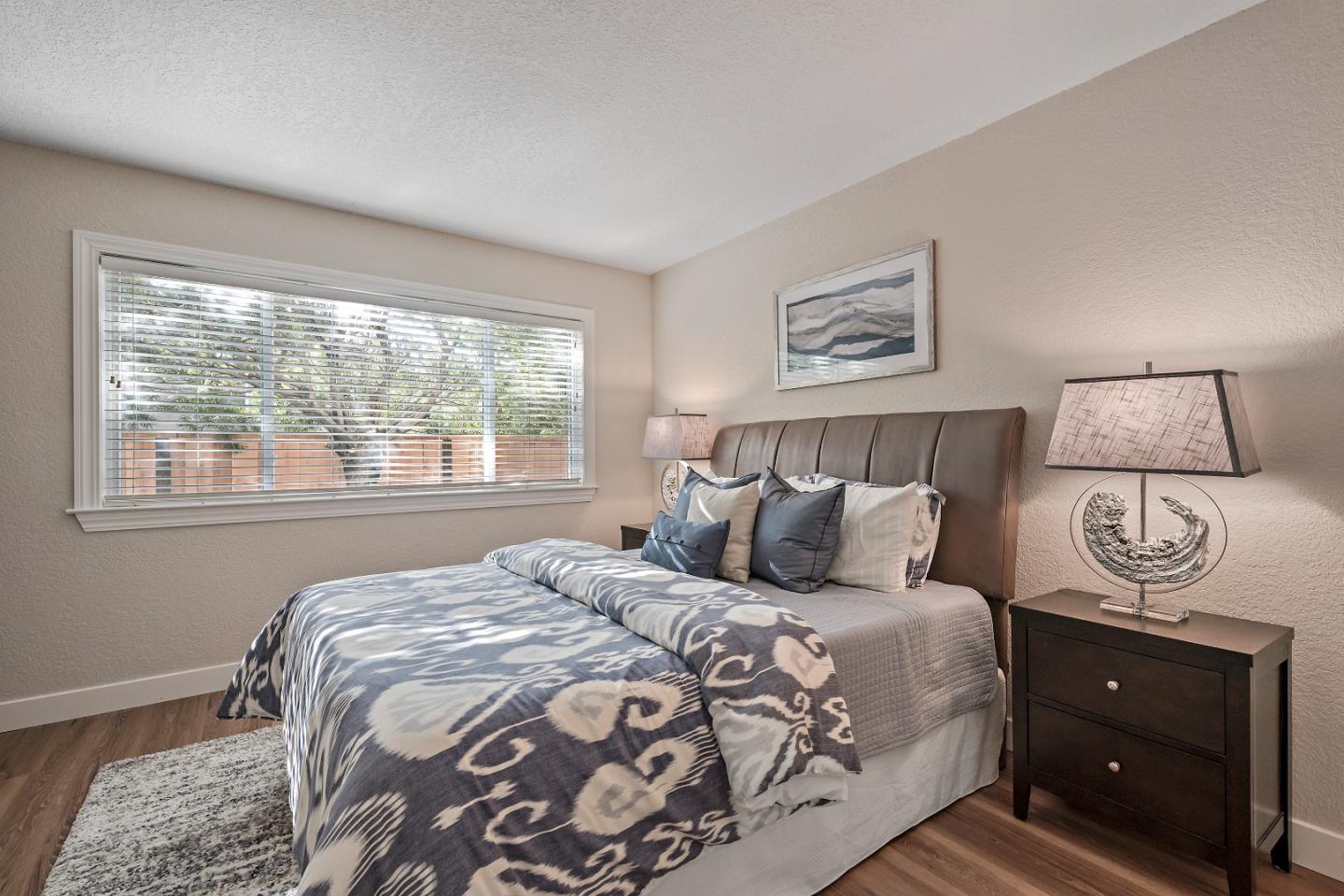 7054 Morecambe Drive San Jose, CA 95120 - Photo 15 of 50 a bedroom with a bed and a window