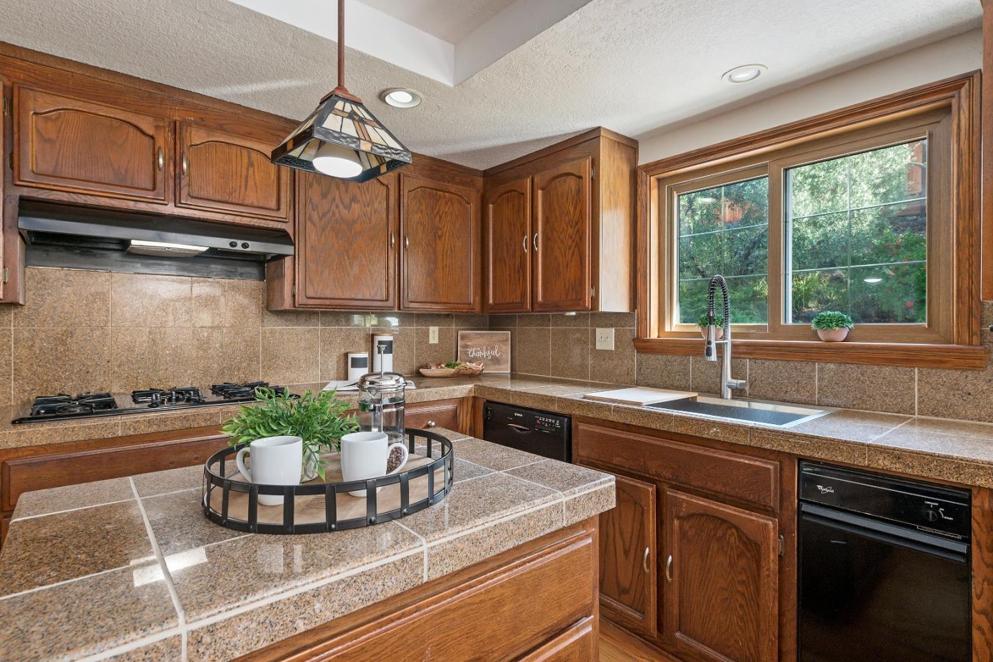 7054 Morecambe Drive San Jose, CA 95120 - Photo 16 of 50 a kitchen with a stove a sink and cabinets