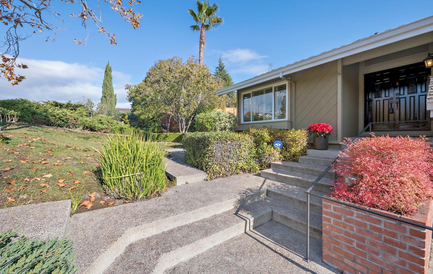 7054 Morecambe Drive San Jose, CA 95120 - Photo 23 of 50 a wooden bench sitting in front of a building