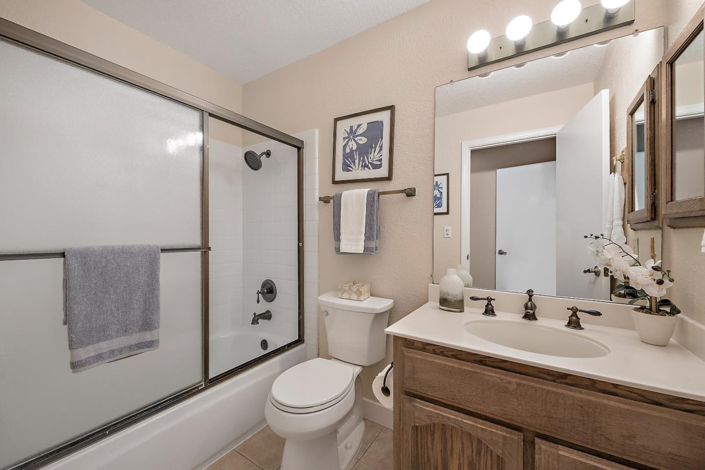 7054 Morecambe Drive San Jose, CA 95120 - Photo 32 of 50 a bathroom with a sink toilet and shower