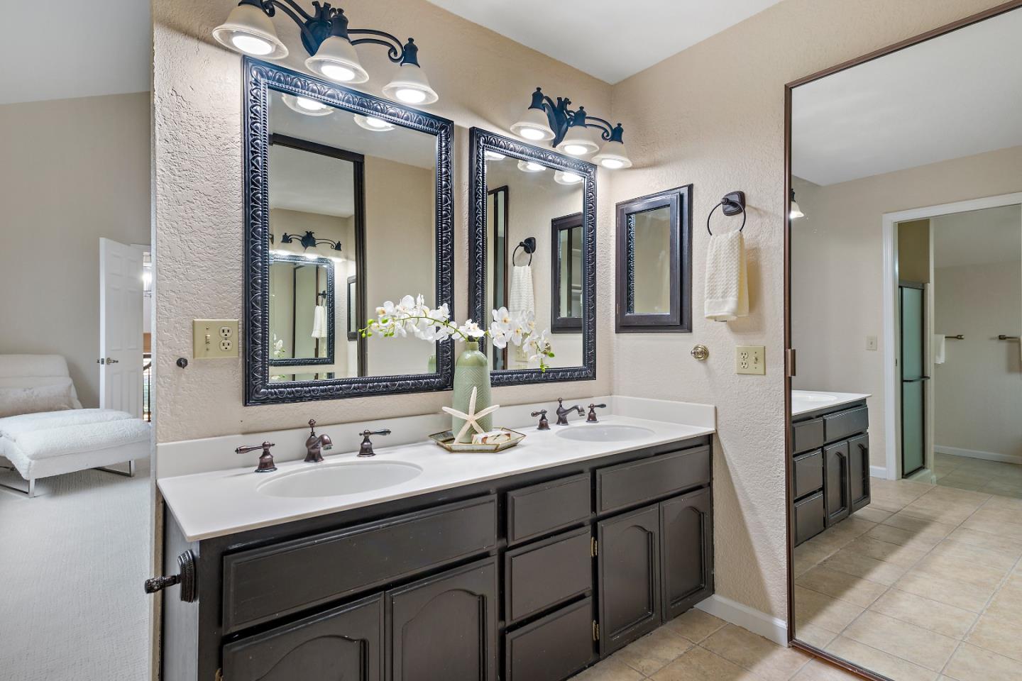 7054 Morecambe Drive San Jose, CA 95120 - Photo 44 of 50 a bathroom with a double vanity sink and a mirror