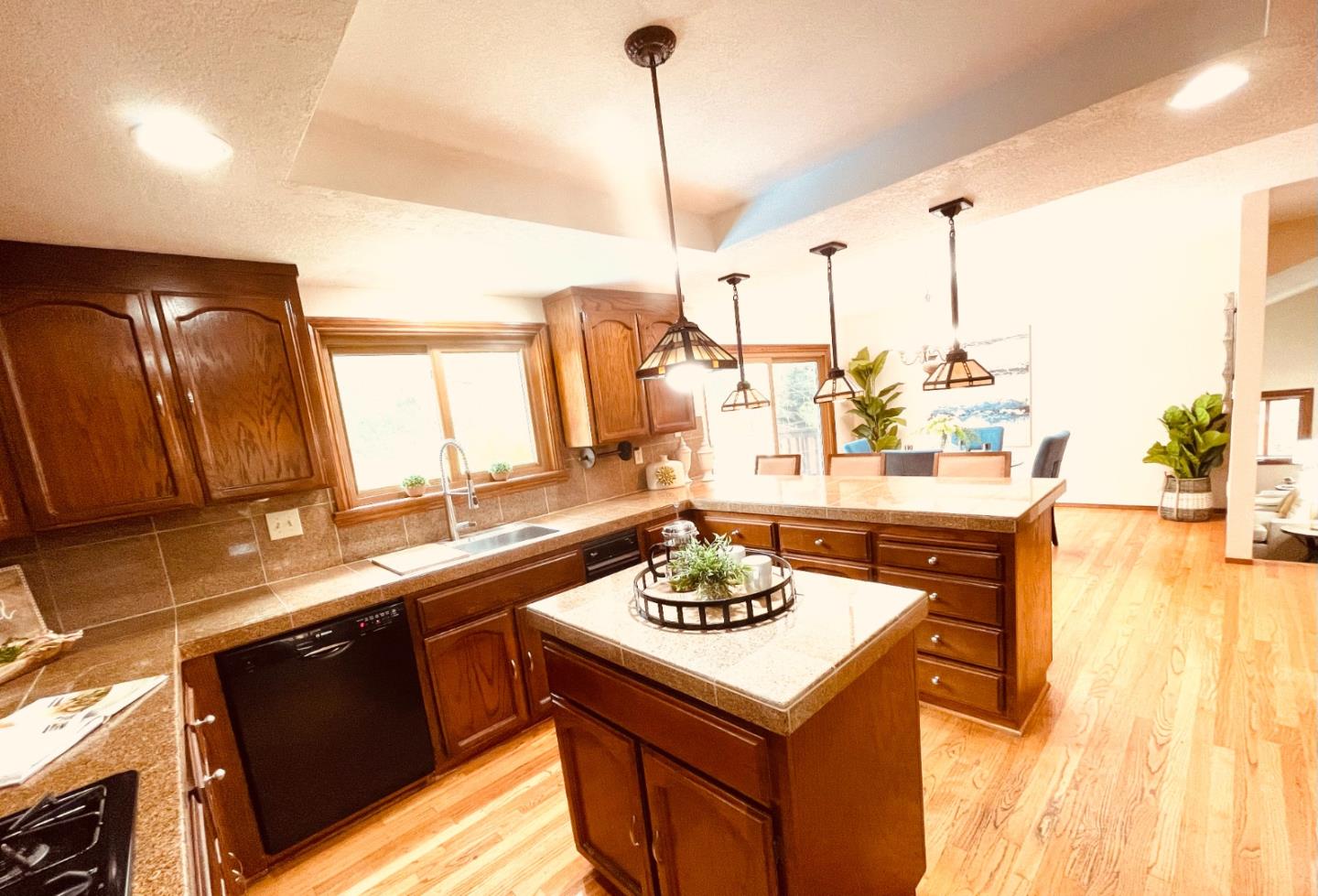 7054 Morecambe Drive San Jose, CA 95120 - Photo 47 of 50 a kitchen with a sink a stove and chairs