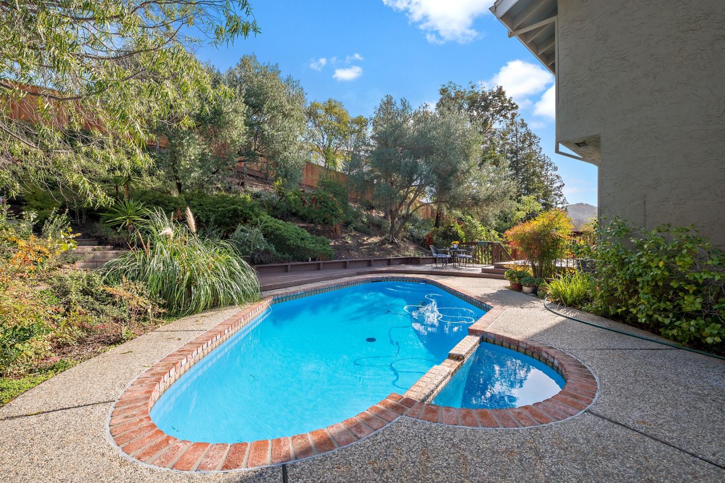 7054 Morecambe Drive San Jose, CA 95120 - Photo 50 of 50 a view of a swimming pool with an outdoor seating