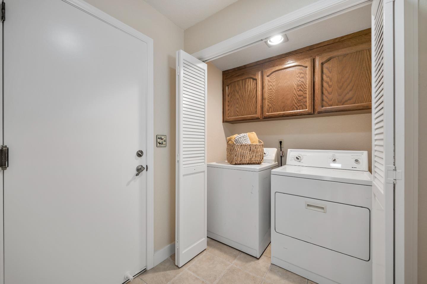 7054 Morecambe Drive San Jose, CA 95120 - Photo 7 of 50 a view of storage and utility room with washer and dryer
