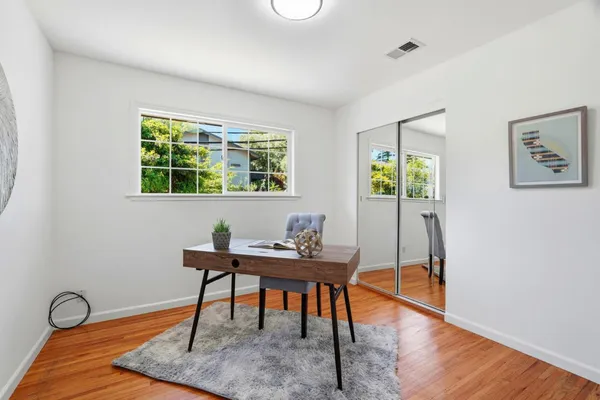 a workspace with furniture and window