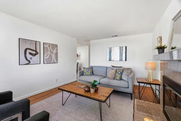 a living room with furniture and a rug