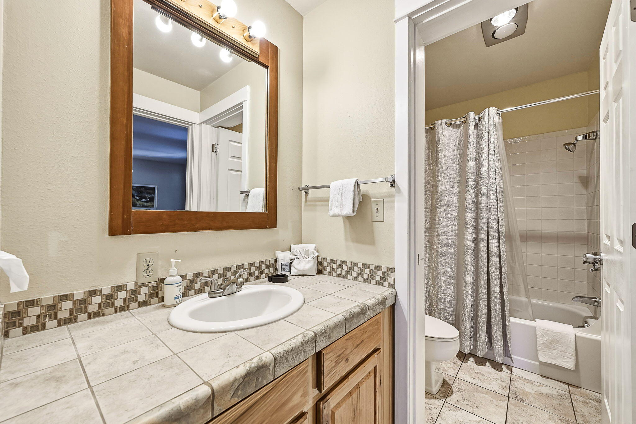18575 Southwest Century Drive, Unit 232 Bend, OR 97702 - Photo 13 of 37 a bathroom with a sink and a mirror