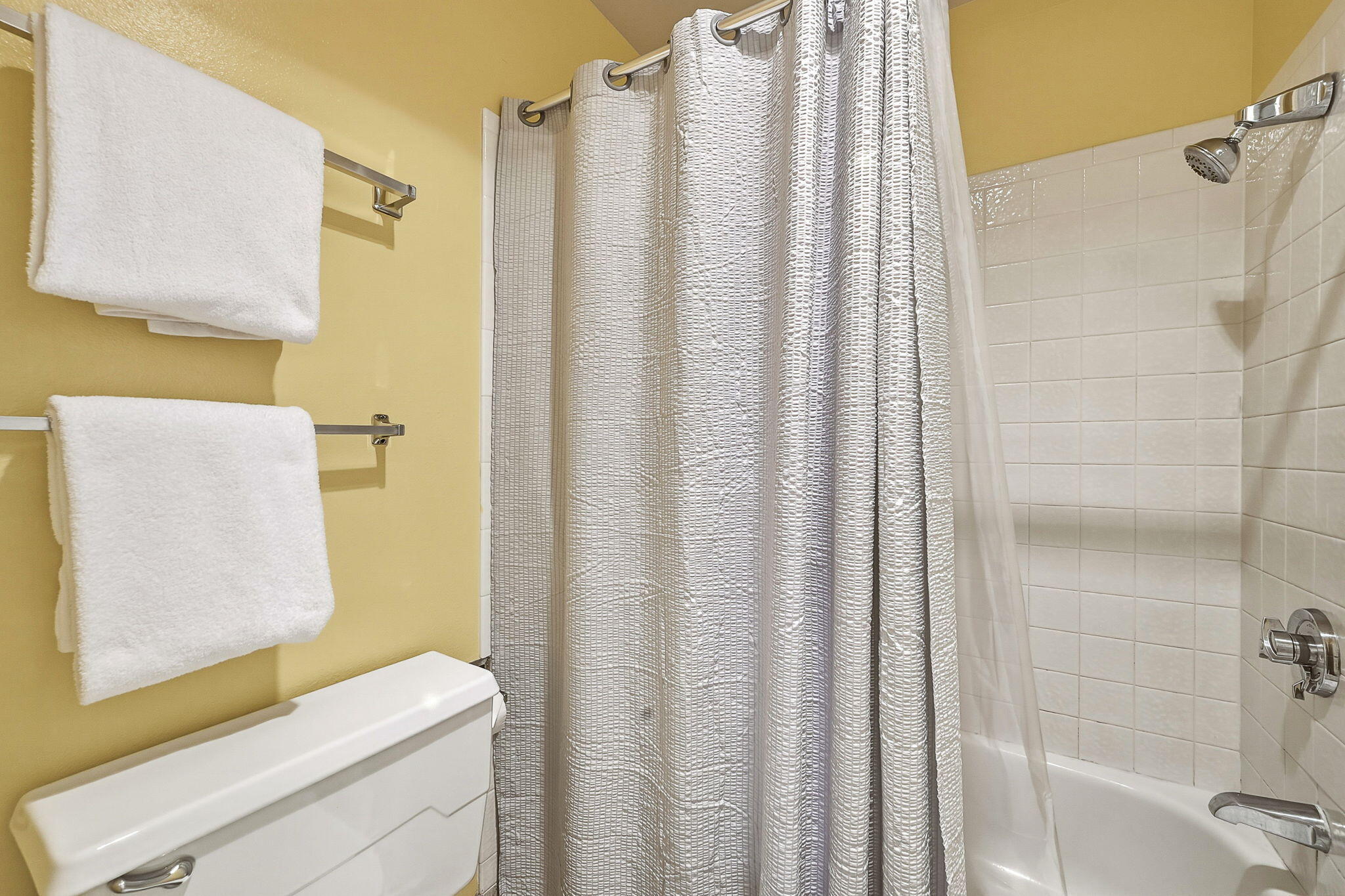 18575 Southwest Century Drive, Unit 232 Bend, OR 97702 - Photo 14 of 37 a bathroom with a shower curtain and a sink