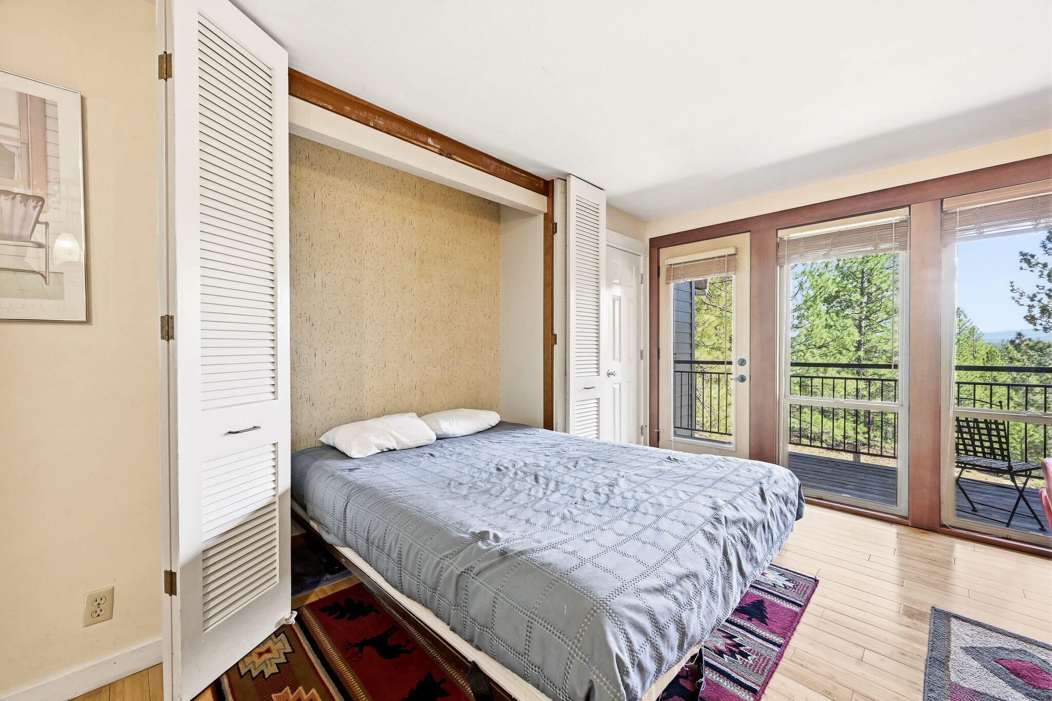 18575 Southwest Century Drive, Unit 232 Bend, OR 97702 - Photo 15 of 37 a bed sitting in a bedroom next to a window